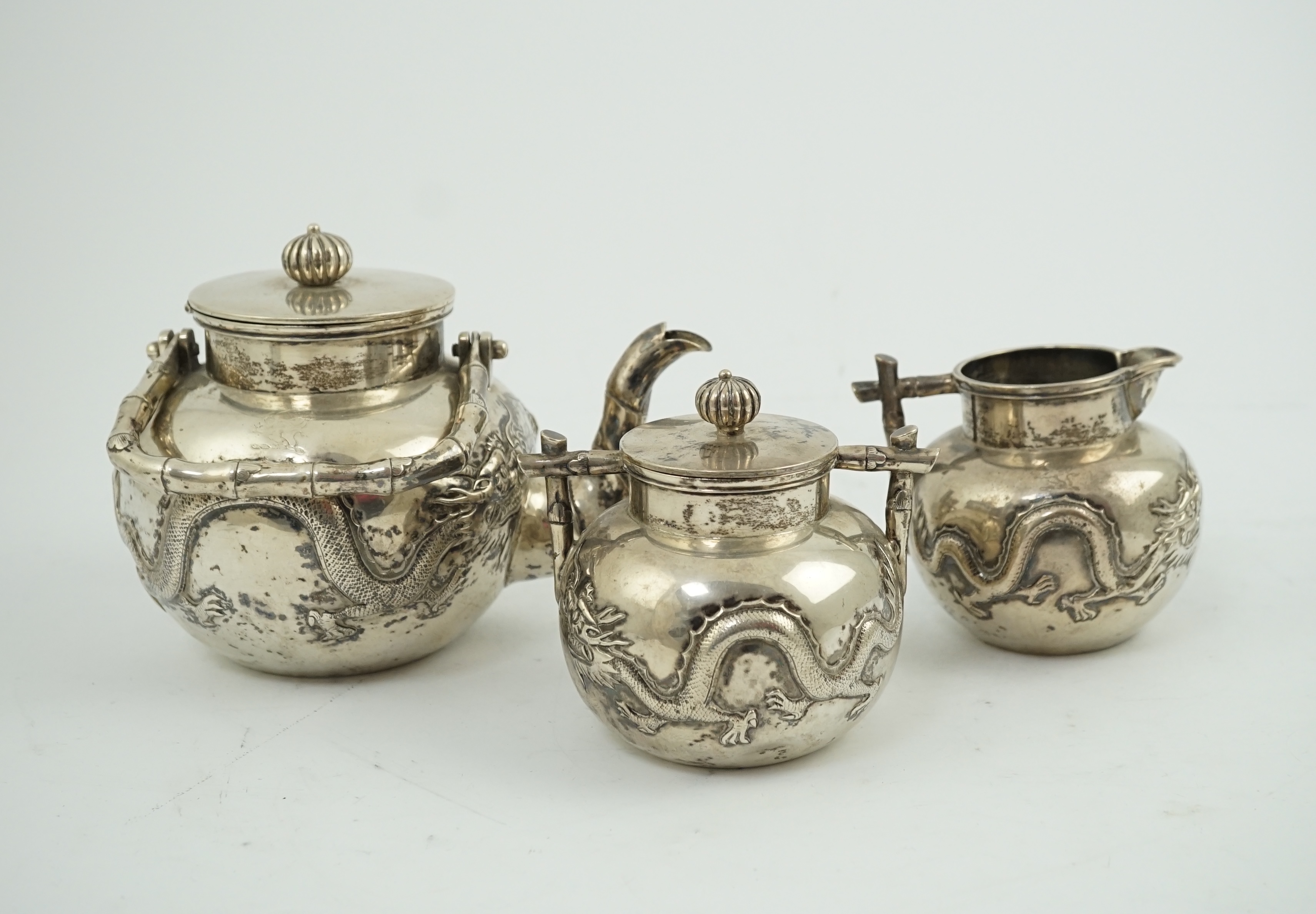 A late 19th/early 20th century Chinese Export silver three piece tea set, by Luen Wo, Shanghai